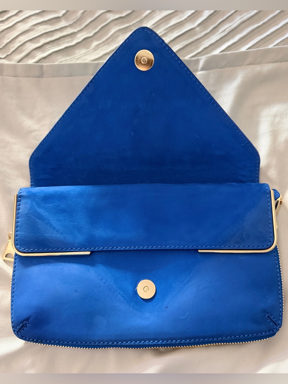 Luxury Designer Brian Atwood 
Blue suede clutch purse with gold zippers